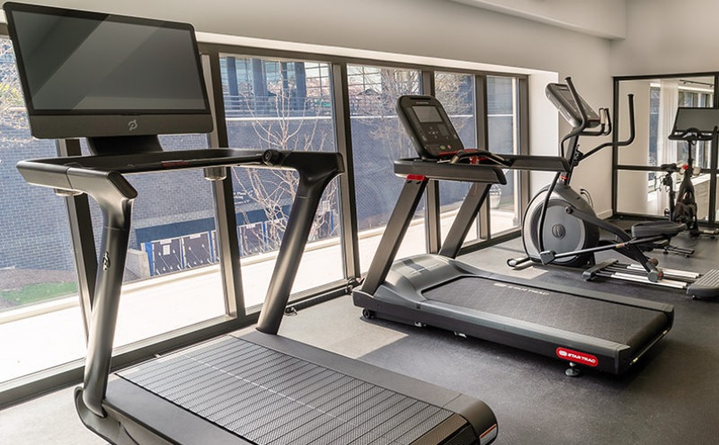 Peleton bikes and treadmill in the fitness center